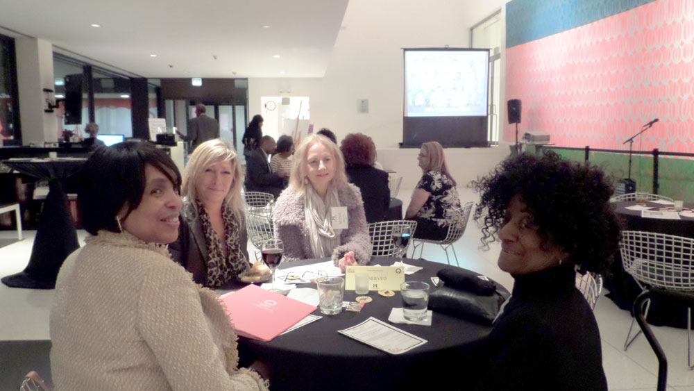 President Dr. Beverly Walker-Griffea (left front) and MCC Board of Trustees President Lenore Croudy (right front) with MCC alumni.