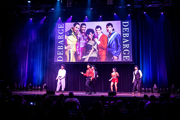 Mott, Motown and More event photo of four men and one woman emulating the musical group DeBarge on stage