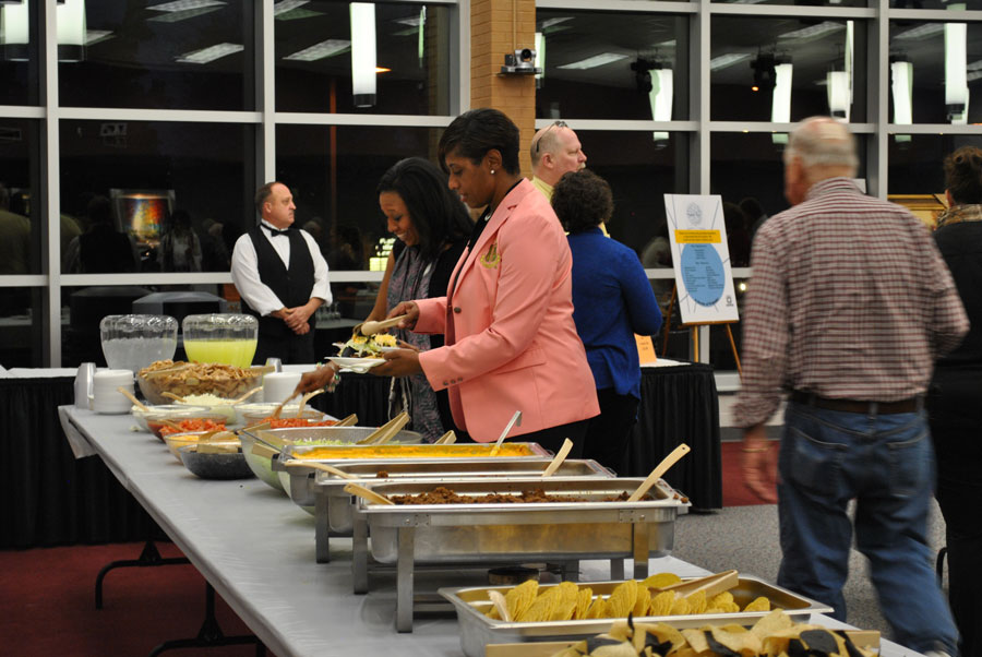 patrons enjoying buffet dinner at the art auction