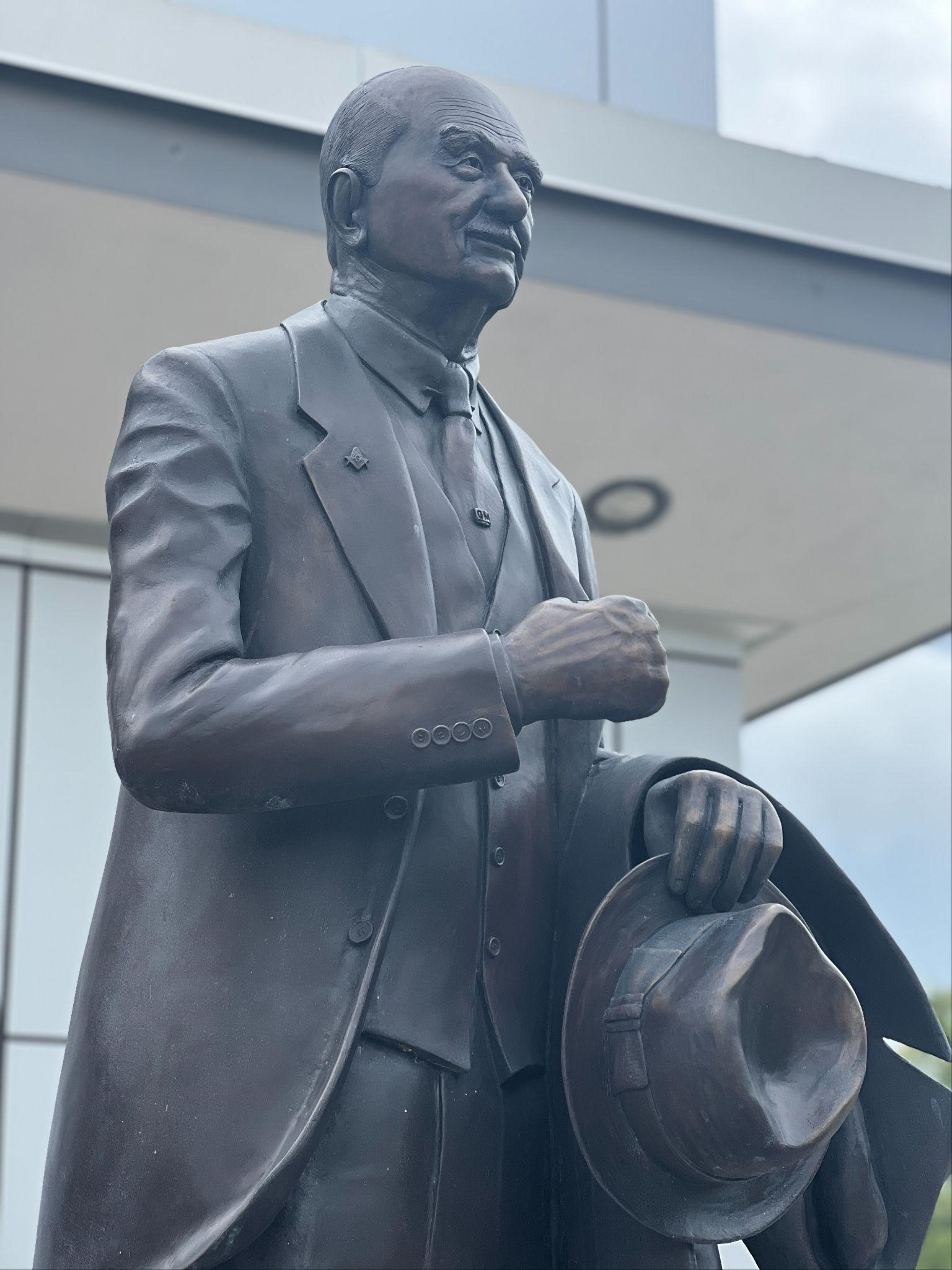 Charles Stewart Mott statue in front of the Mott Library