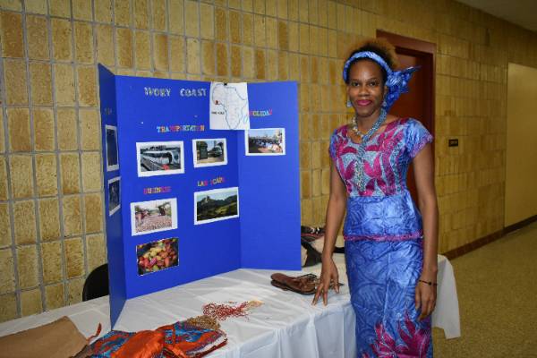 student with information display poster