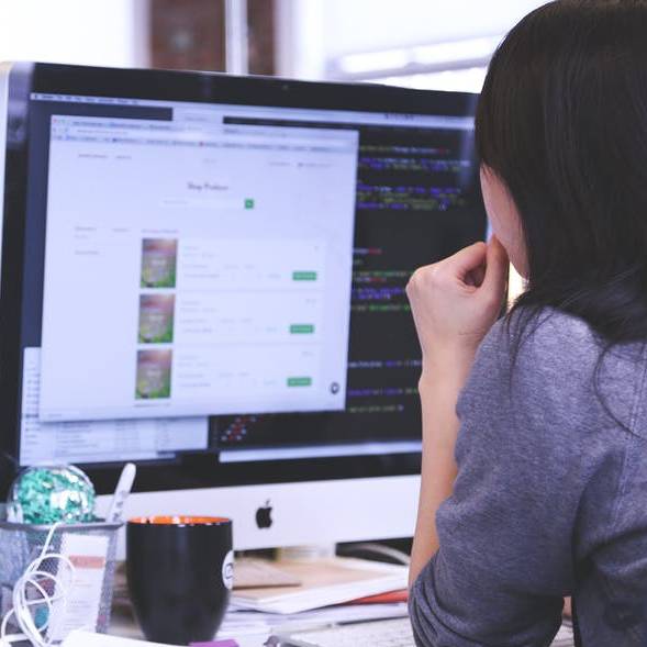 student sitting at computer screen